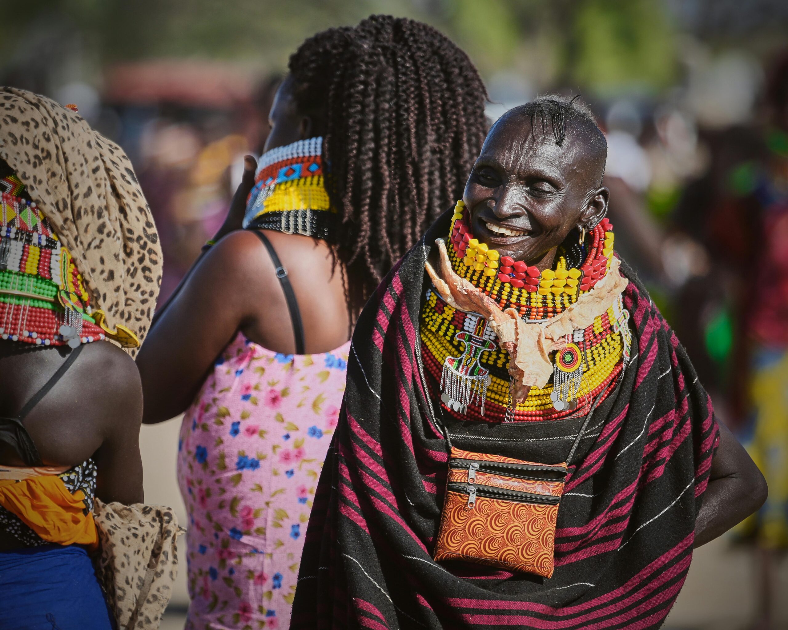 Vibrant display of traditional African attire during a cultural celebration outdoors.
